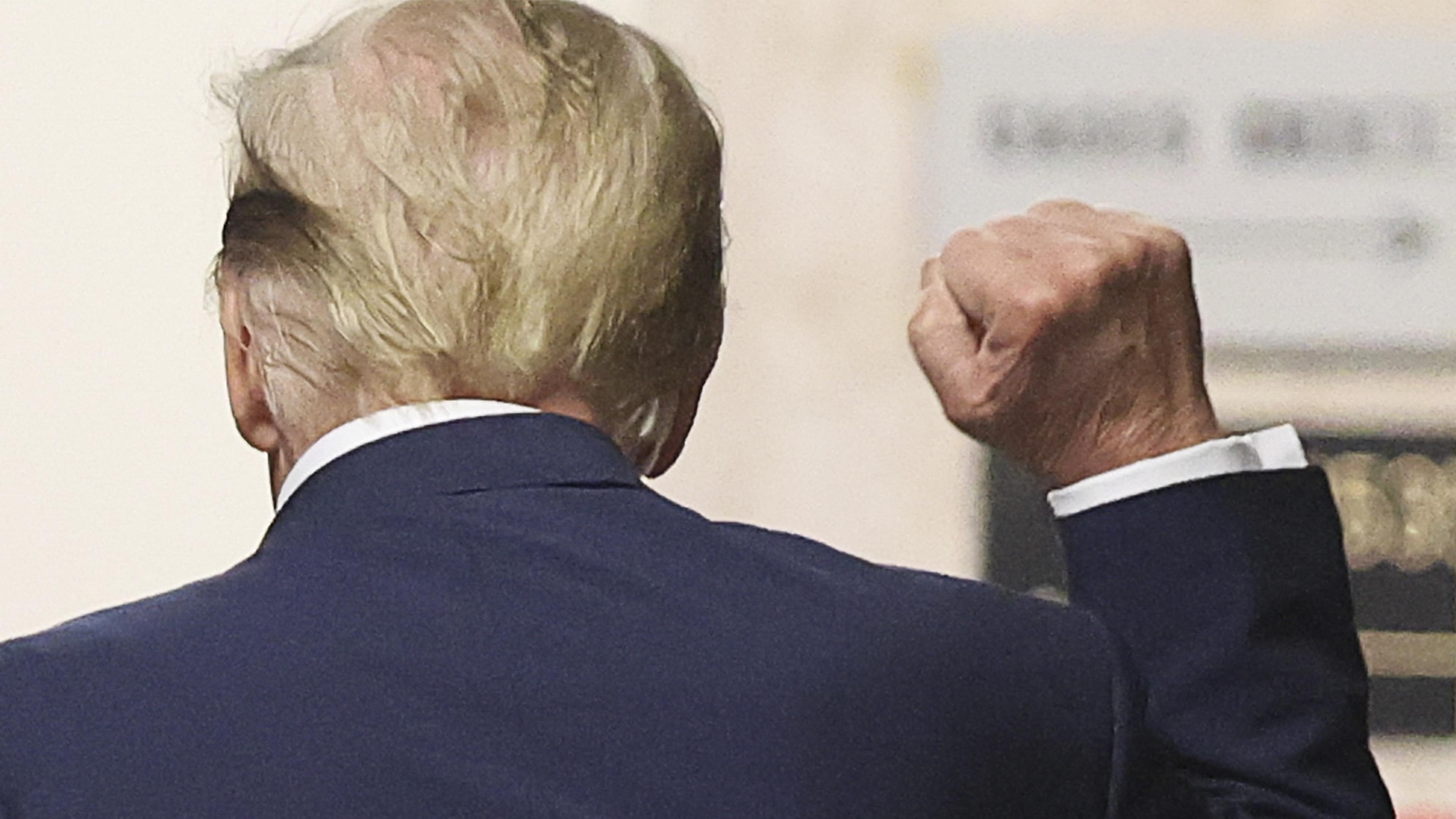 TOPSHOT - Former US President Donald Trump gestures in the hallway outside the courtroom during a recess in his trial for allegedly covering up hush money payments linked to extramarital affairs, at Manhattan Criminal Court in New York City on April 18, 2024. Trump's criminal trial resumes Thursday with Judge Juan Merchan seeking to complete jury selection. Moving the US into uncharted waters, it is the first criminal trial of a former US president, one who is also battling to retake the White House in November. (Photo by Brendan McDermid / POOL / AFP)
