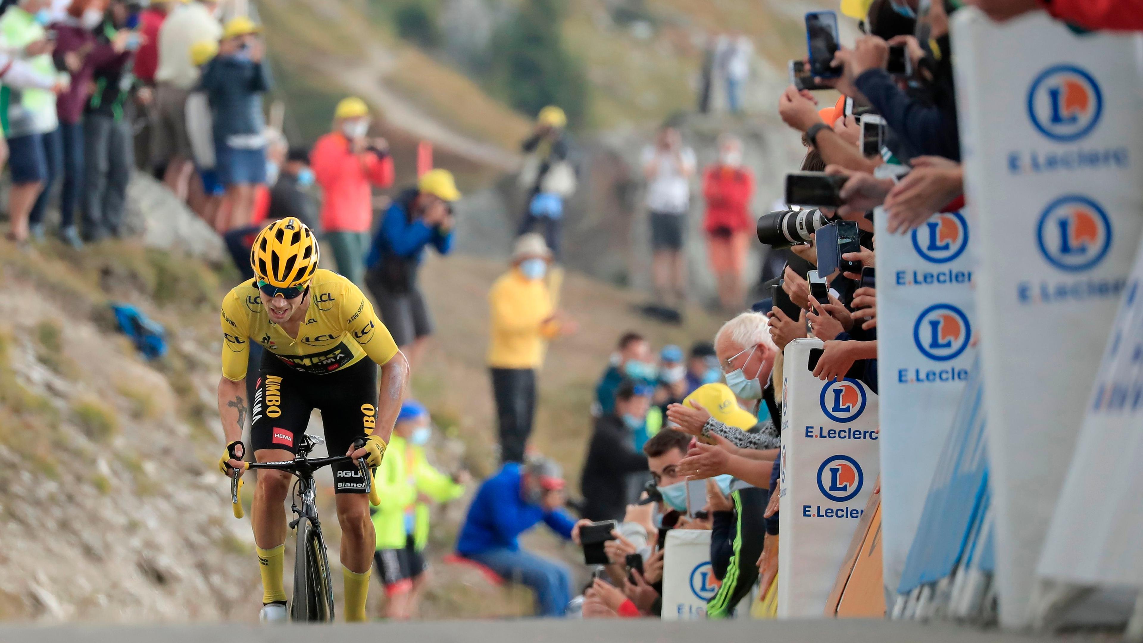 Team Jumbo rider Slovenia's Primoz Roglic wearing the overall leader's yellow jersey crosses the finish line atop the Loze pass (Col de la Loze) at the end of the 17th stage of the 107th edition of the Tour de France cycling race, 170 km between Grenoble and Meribel, on September 16, 2020. (Photo by christophe petit tesson / POOL / AFP)