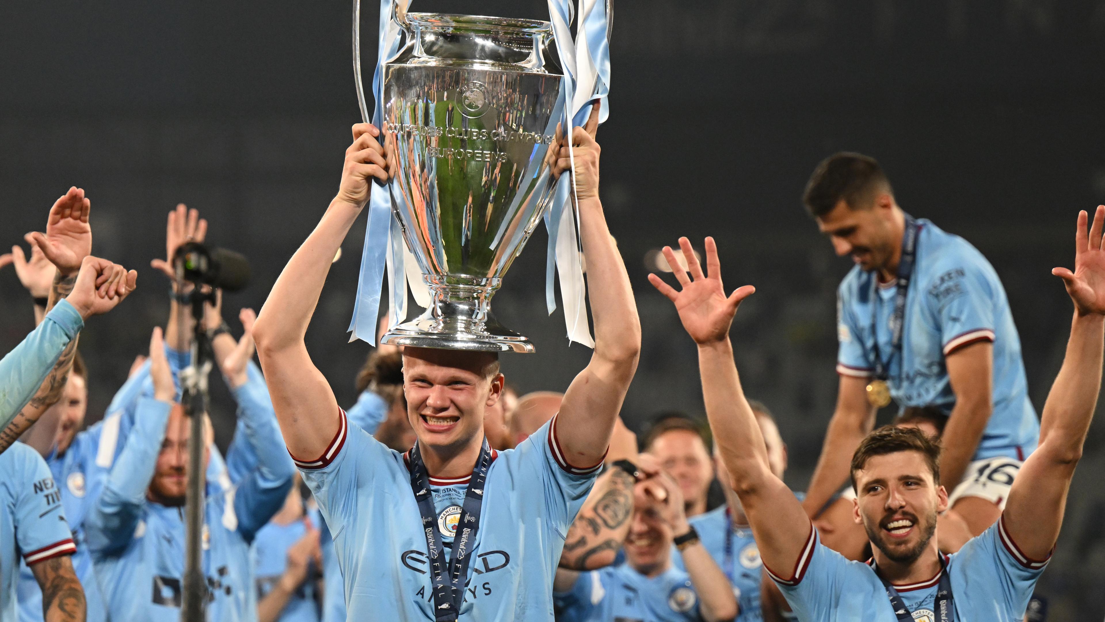 Manchester City striker Erling Haaland lifting the Champions League trophy in June 2023