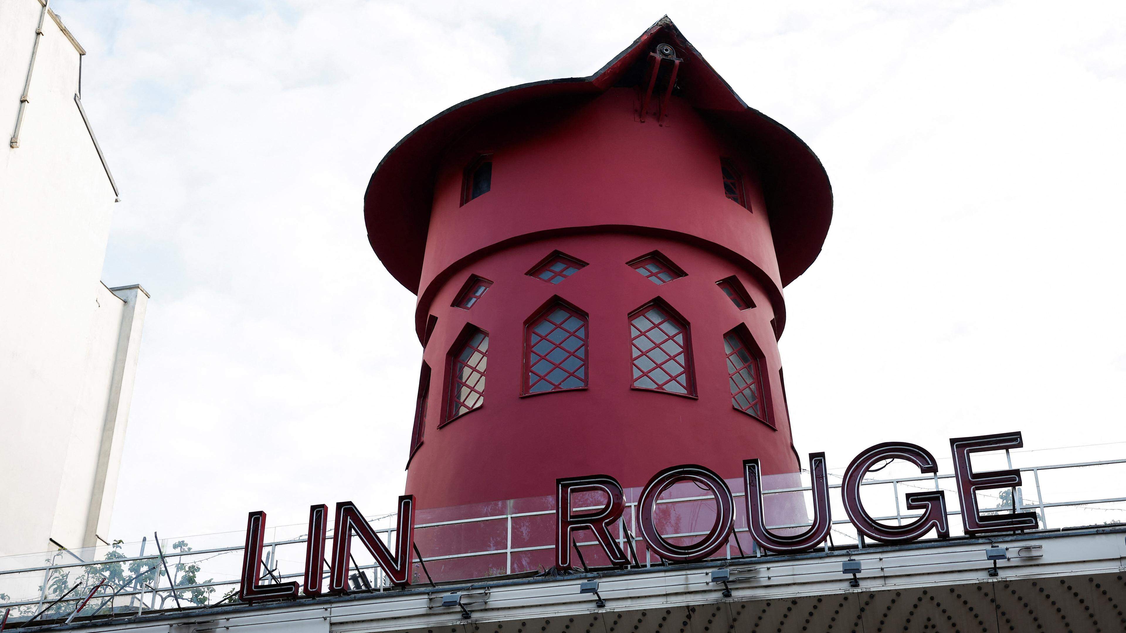 A view of the landmark red windmill atop the Moulin Rouge, Paris' most famous cabaret club, after its sails fell off during the night in Paris, France, April 25, 2024. REUTERS/Benoit Tessier