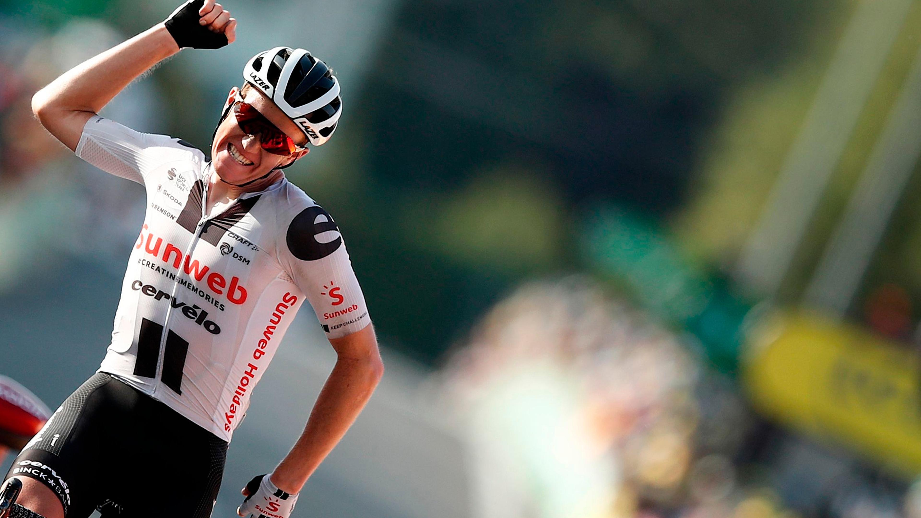Stage winner Team Sunweb rider Denmark's Soren Kragh Andersen celebrates as he crosses the finish line at the end of the 19th stage of the 107th edition of the Tour de France cycling race, 160 km between Bourg-en-Bresse and Champagnole, on September 18, 2020. (Photo by BENOIT TESSIER / various sources / AFP)