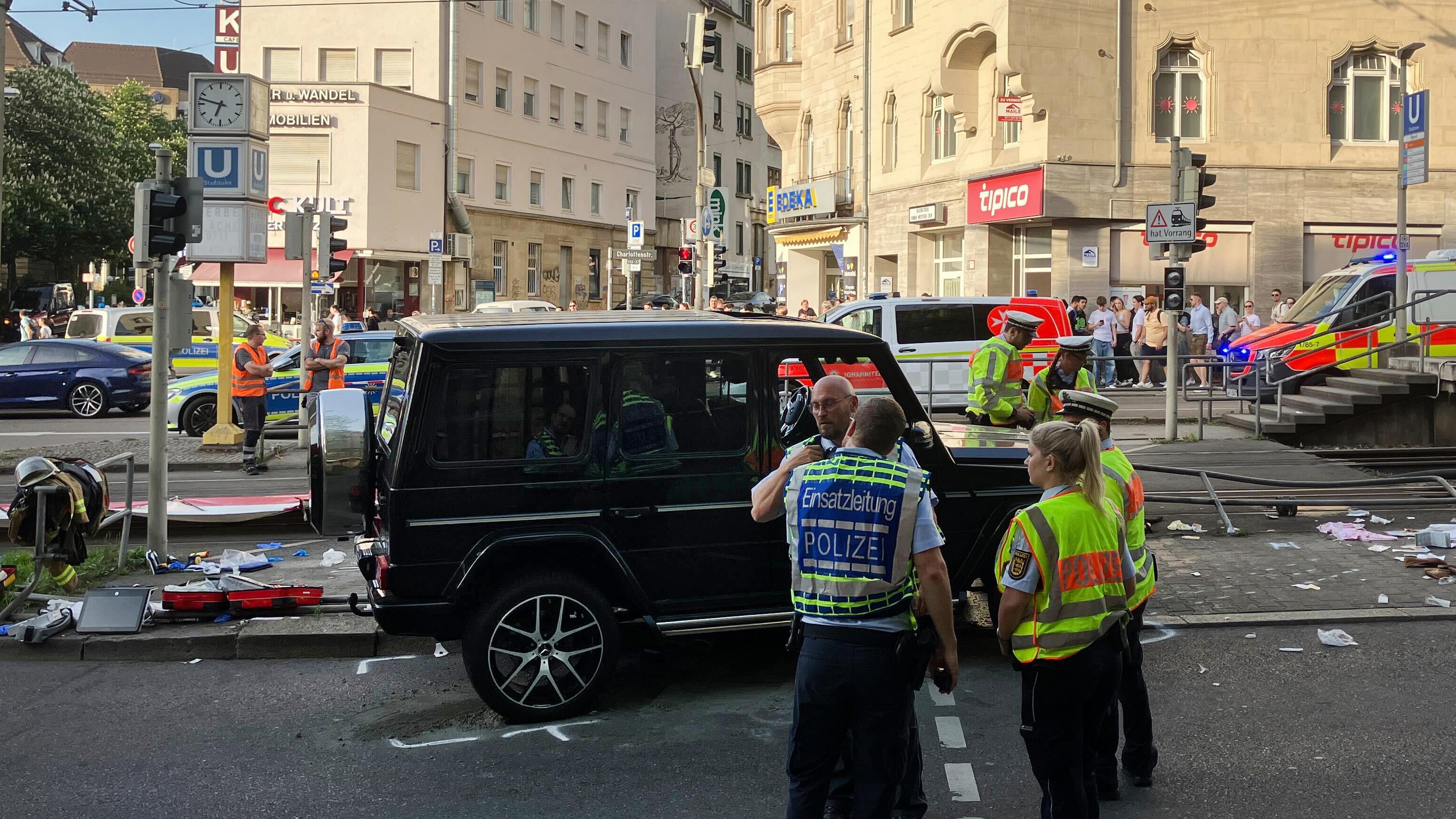 Car drives in a group of people in Stuttgart