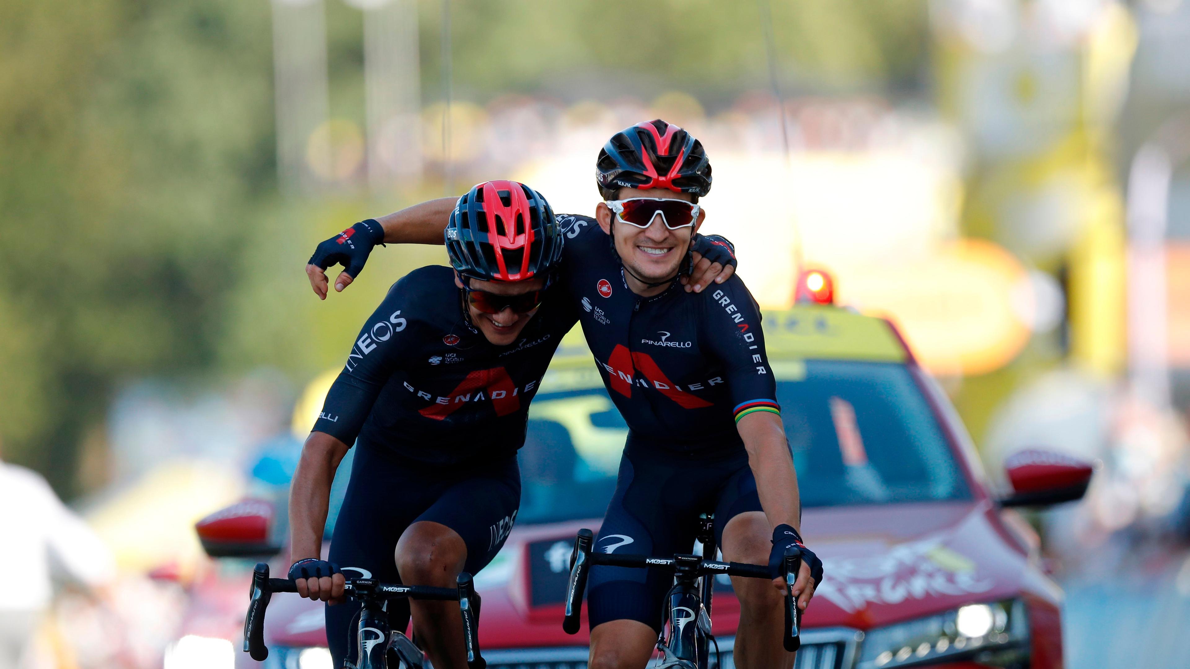 Team Ineos rider Poland's Michal Kwiatkowski (R) celebrates as he crosses the finish line ahead of Team Ineos rider Ecuador's Richard Carapaz during the 18th stage of the 107th edition of the Tour de France cycling race, 168 km between Meribel and La Roche sur Foron, on September 17, 2020. (Photo by STEPHANE MAHE / POOL / AFP)