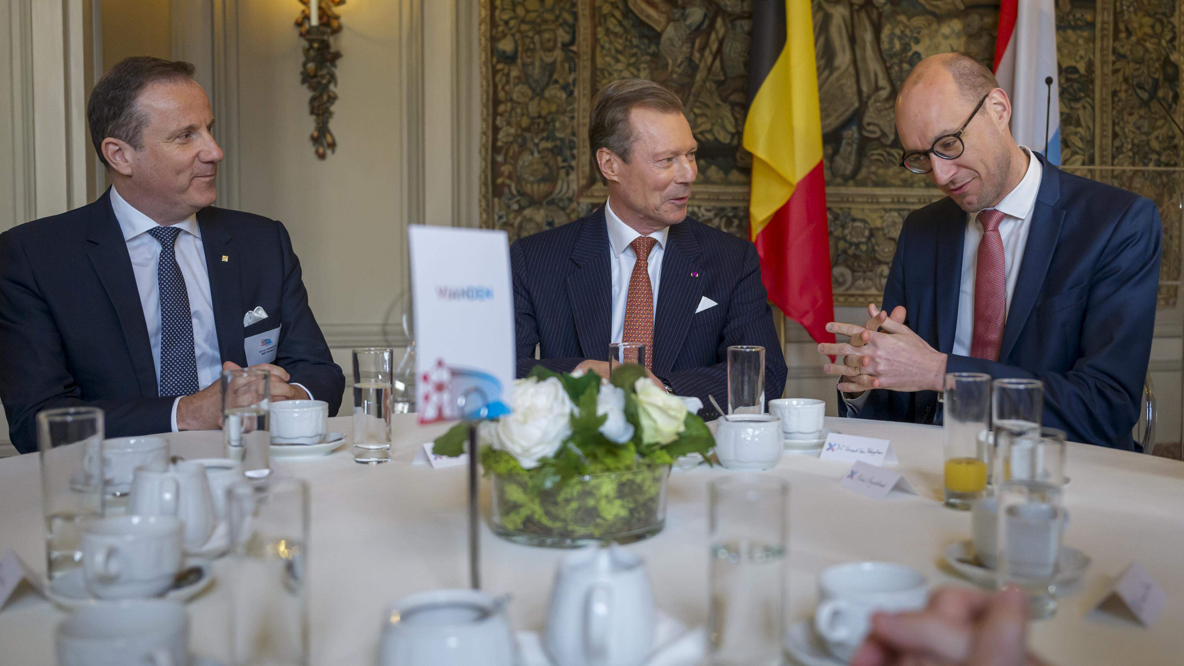 BNP Paribas CEO and Chairman Michael Anseeuw (left) and Belgian Finance Minister Vincent Van Peteghem (right) dine with Luxembourg’s Grand Duke Henri during his visit to Belgium on 17 April