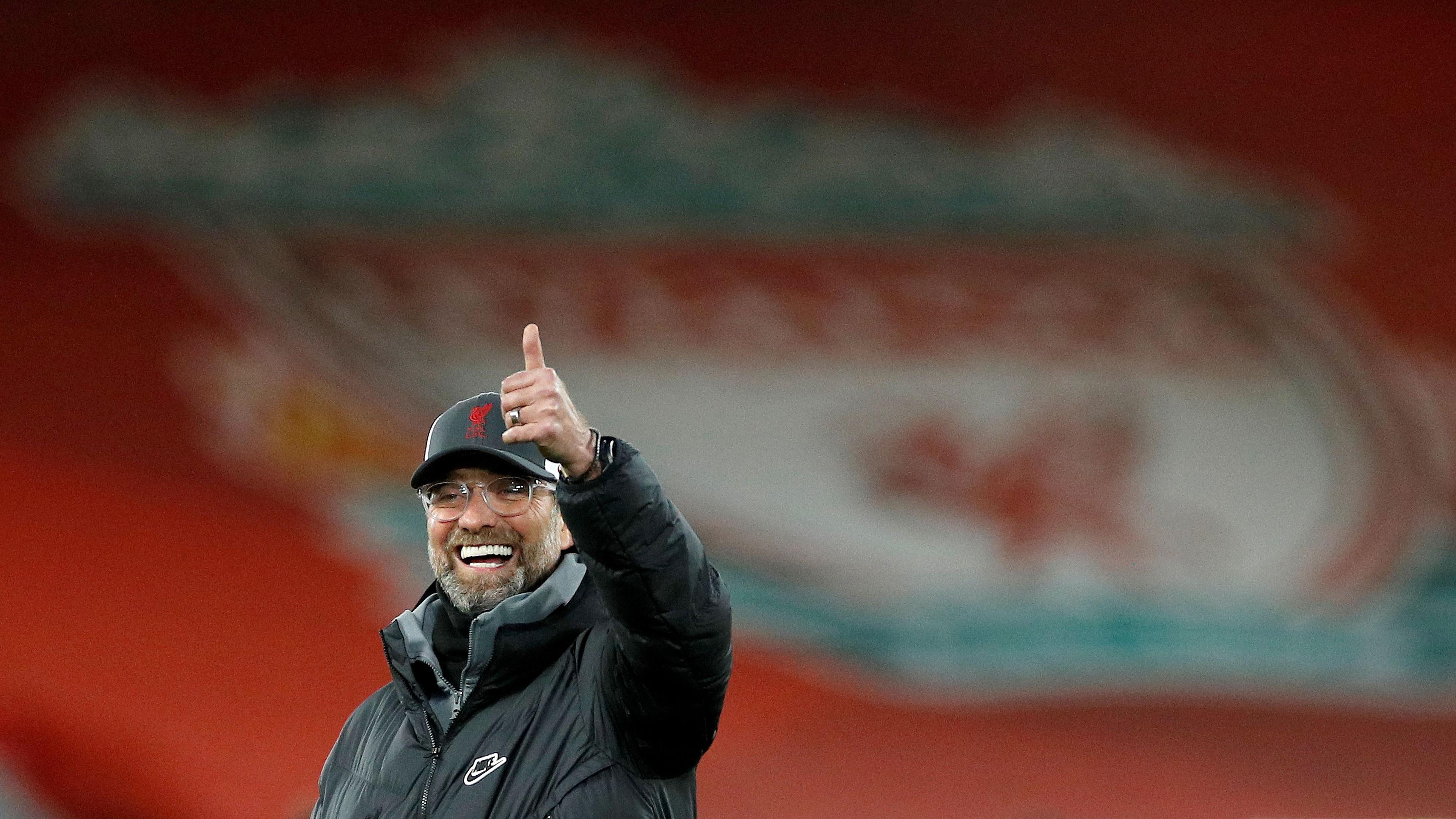 (FILES) Liverpool's German manager Jurgen Klopp reacts as his players warm up for the English Premier League football match between Liverpool and Brighton and Hove Albion at Anfield in Liverpool, north west England on February 3, 2021. Jurgen Klopp will manage his last match, at Anfield on May 19, 2024 after announcing in January of the same year, that he would be stepping down at the end of the season. The German coach became the only Liverpool manager to complete the collection of Premier League, Champions League, FA Cup, League Cup, Club World Cup and Community Shield during his nine year tenure. (Photo by PHIL NOBLE / AFP)