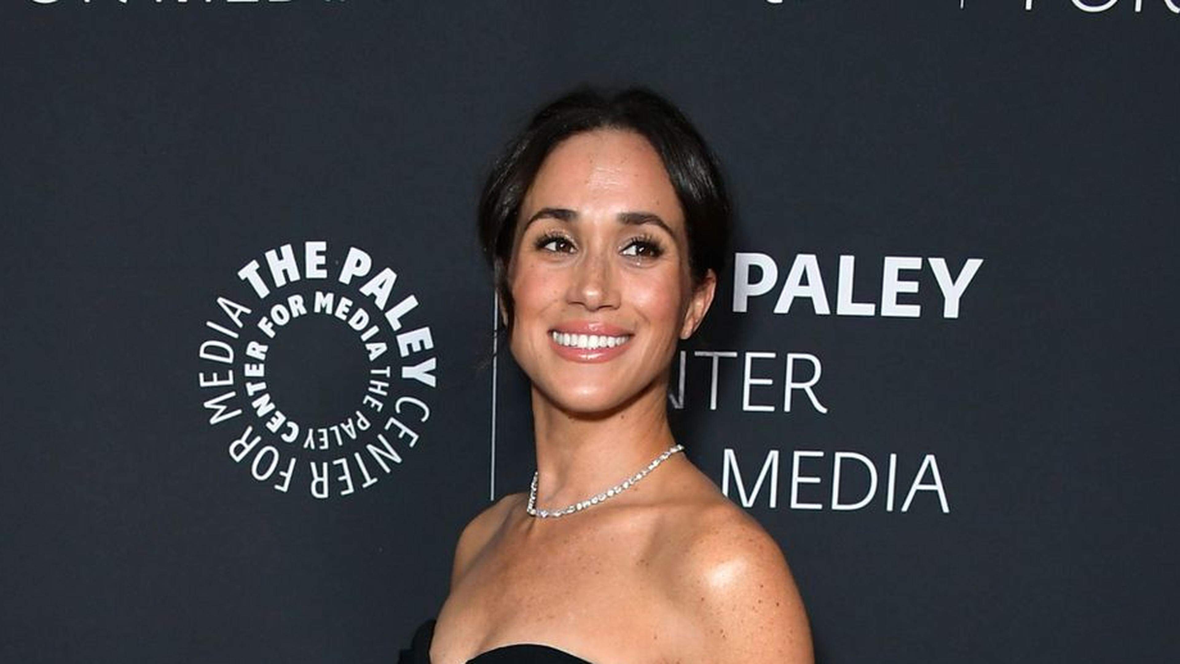 With the princess in her arms: Meghan shows birthday photos