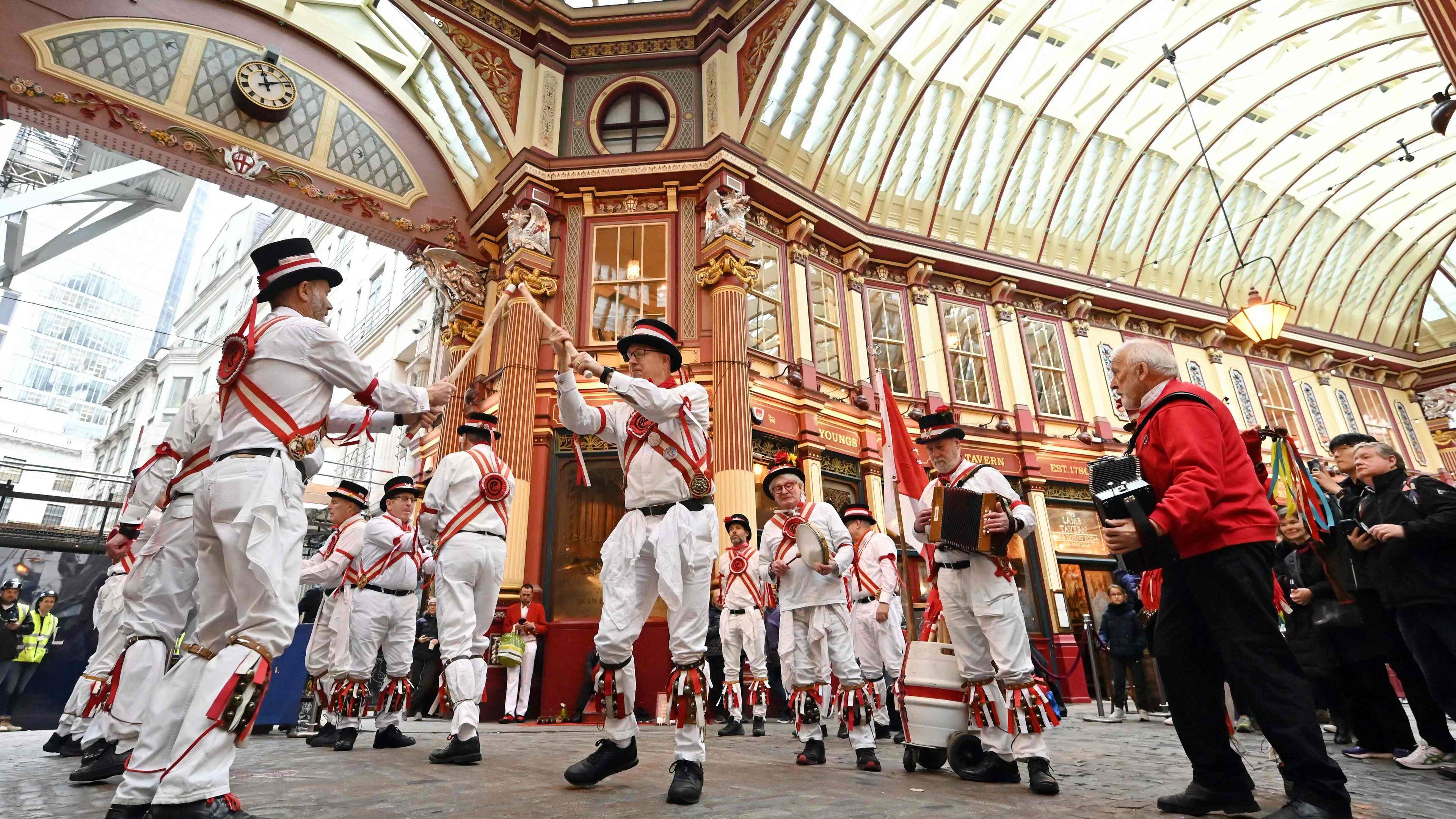 Ewell St Mary's Morris Men perform at Leadenhall Market, in London, for St George's Day, on April 23, 2024. (Photo by JUSTIN TALLIS / AFP)