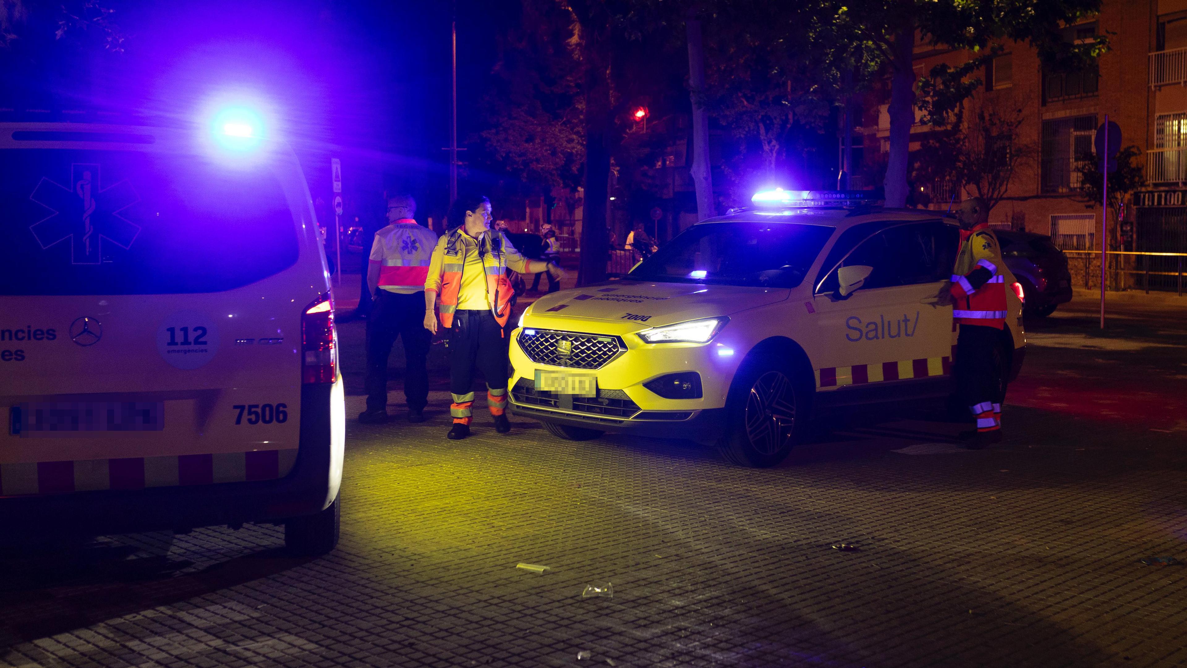 Car drives in Barcelona through a lot of waiting football fans