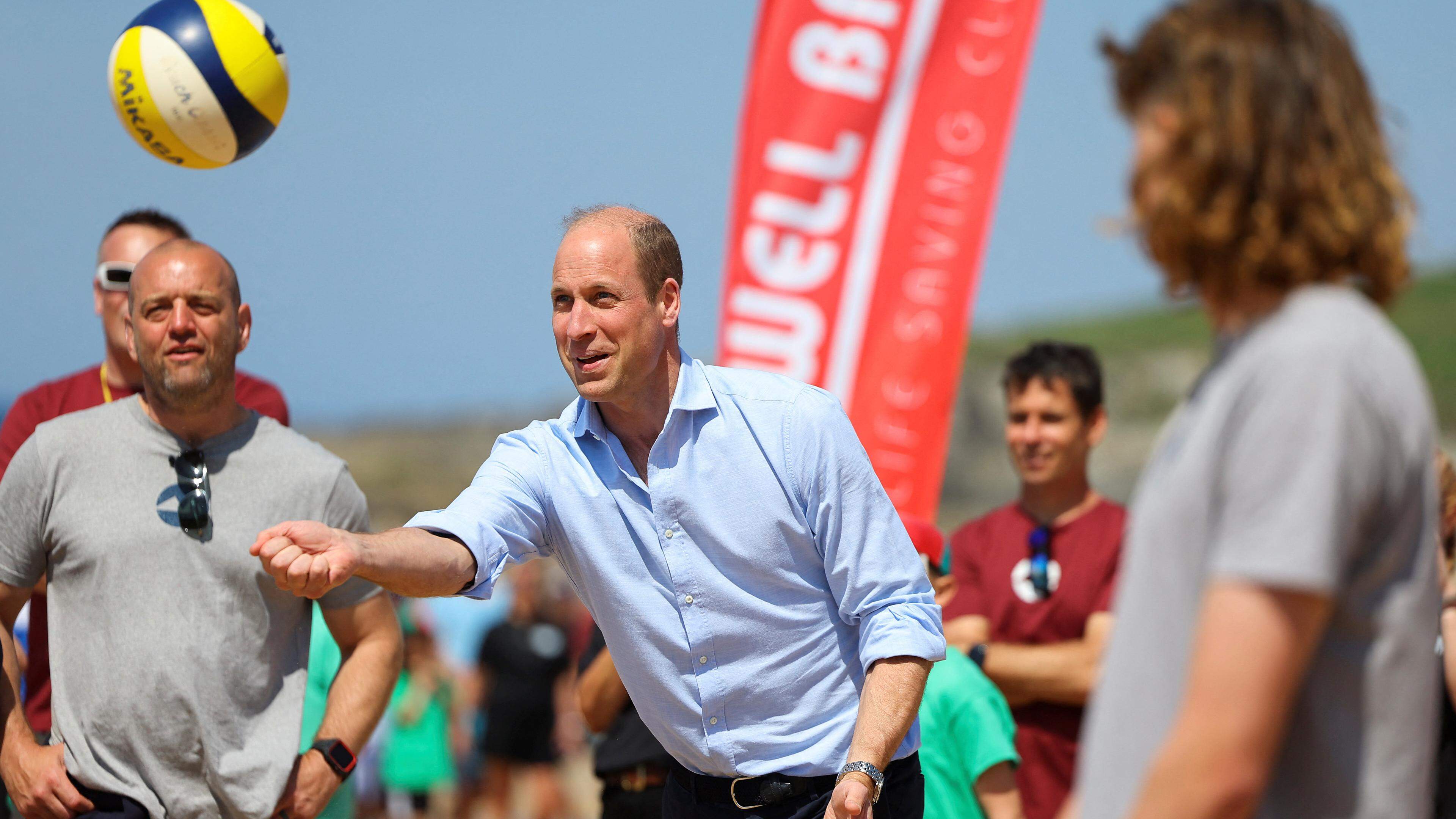 Britain's Prince William, the Duke of Cornwall plays volleyball, as he visits Fistral Beach in Newquay, Britain, May 9, 2024. REUTERS/Toby Melville/Pool